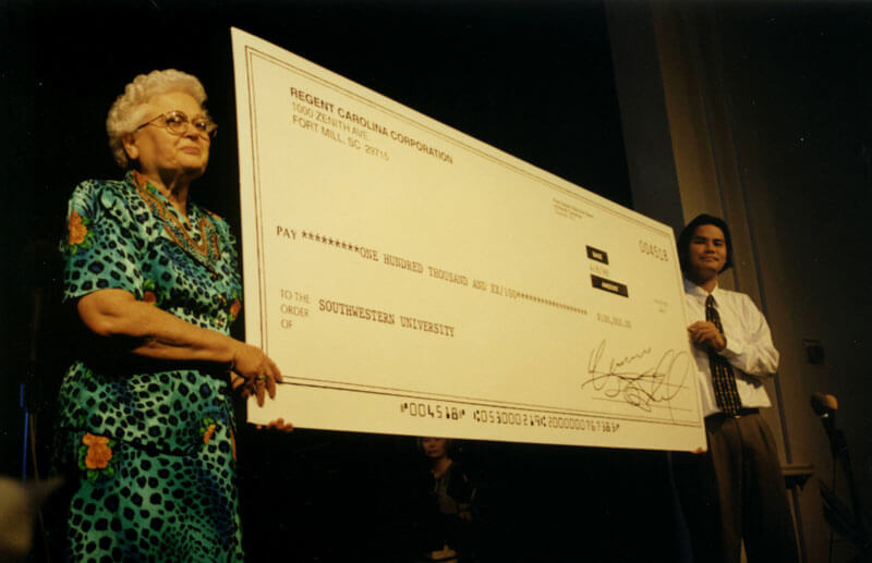 holding big check