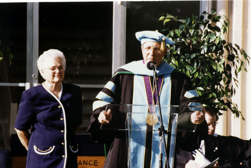 man at graduation speaking