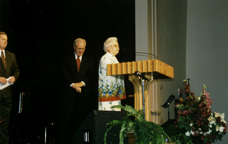 man speaking at podium