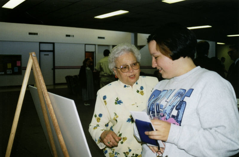 women looking at picture