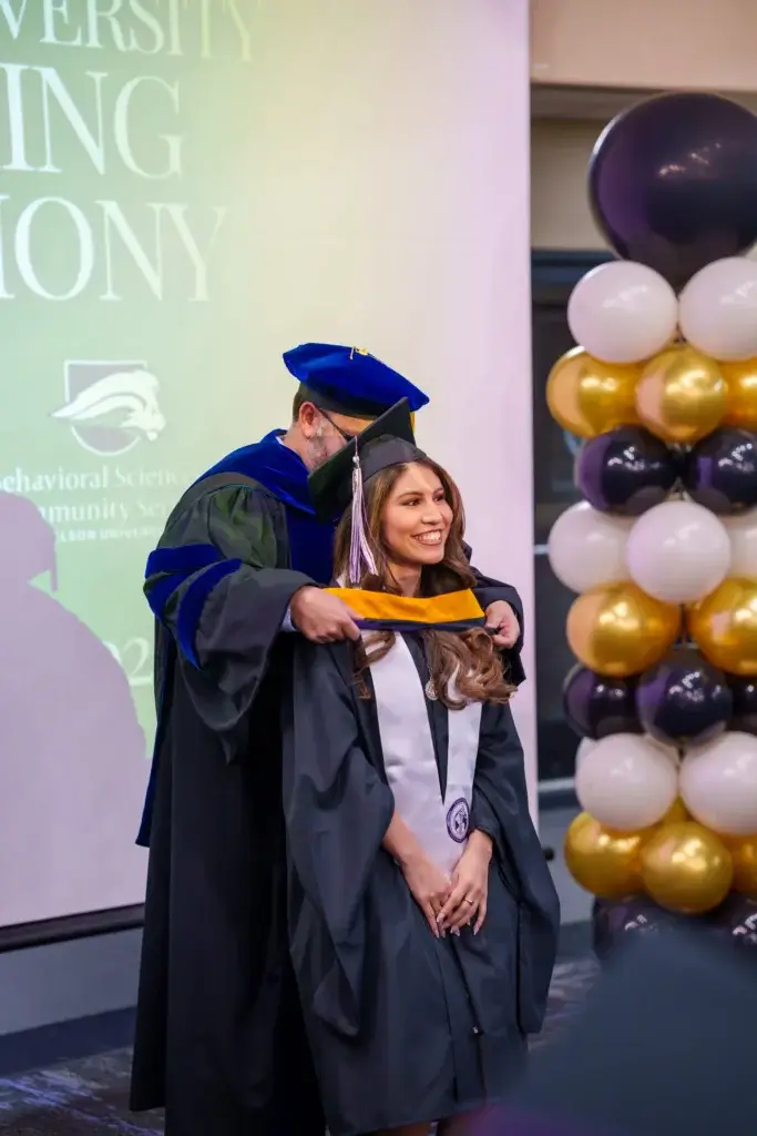 Student receiving their hood