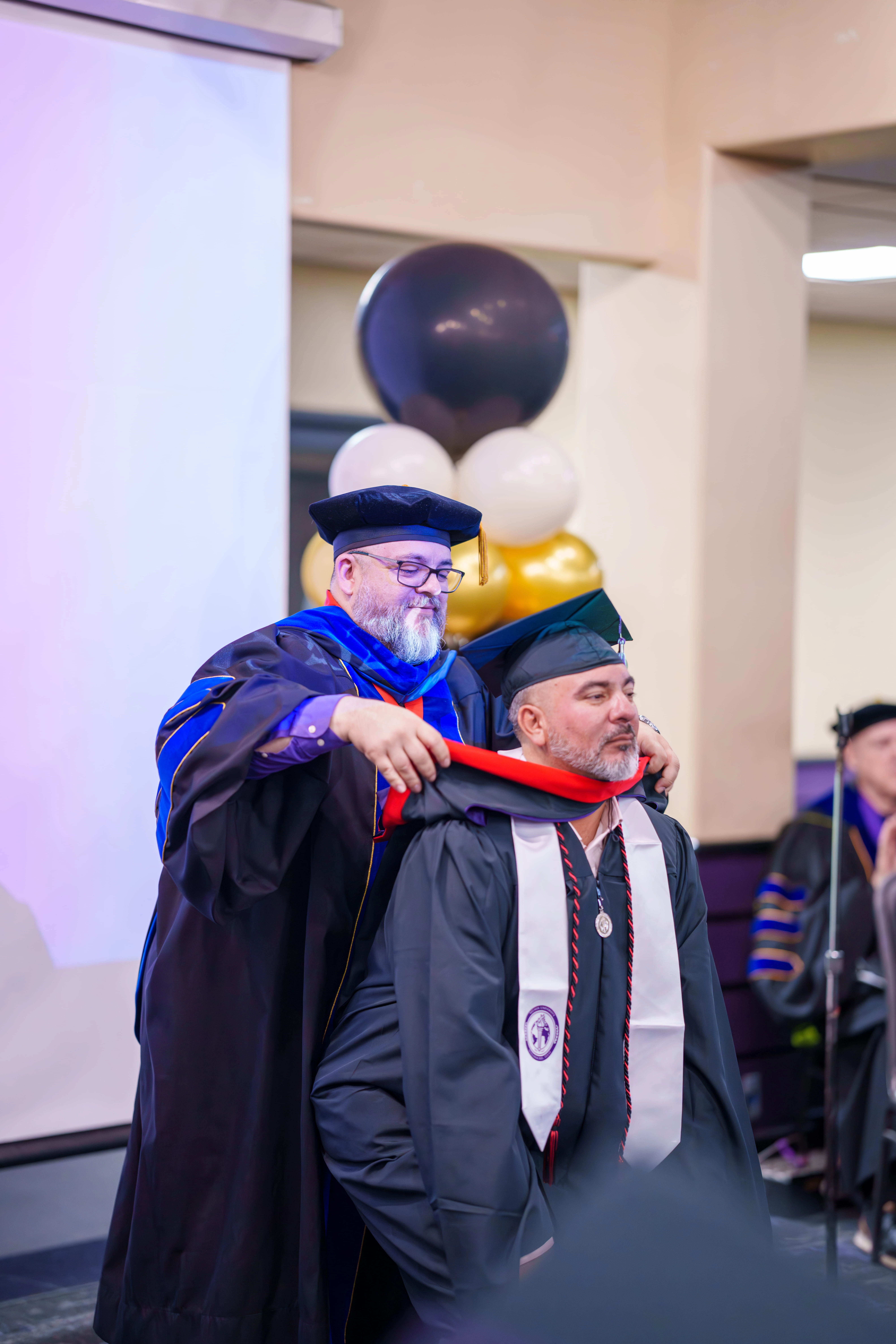 Student receiving their hood
