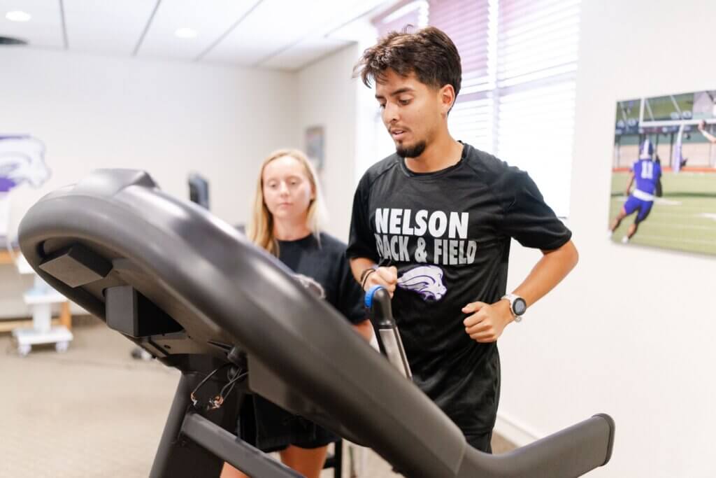 Student running on a treadmill