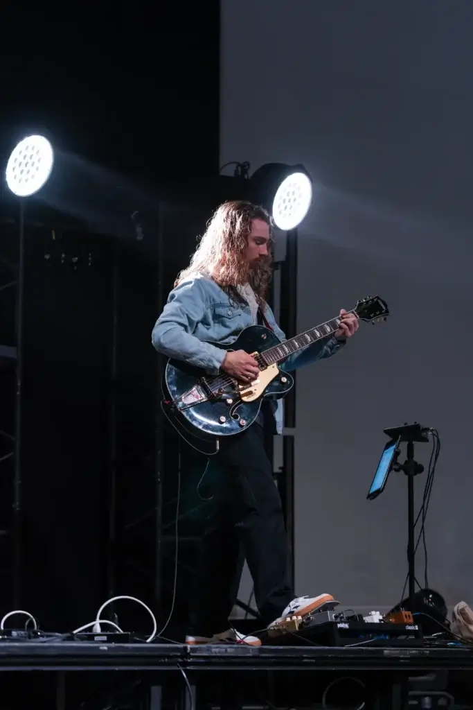 Student playing guitar