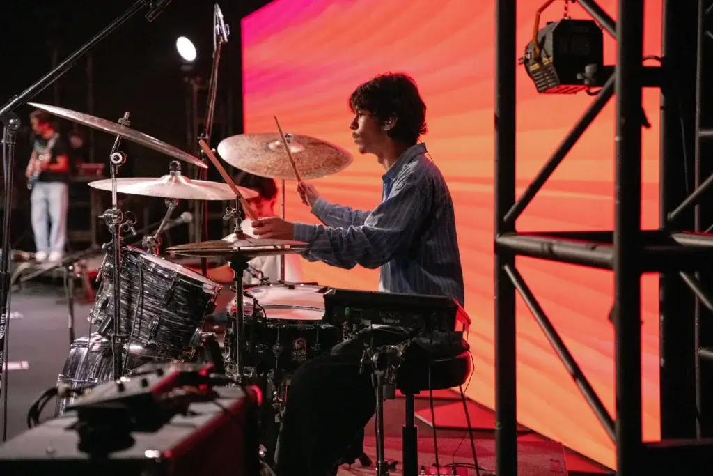Drummer drumming on stage