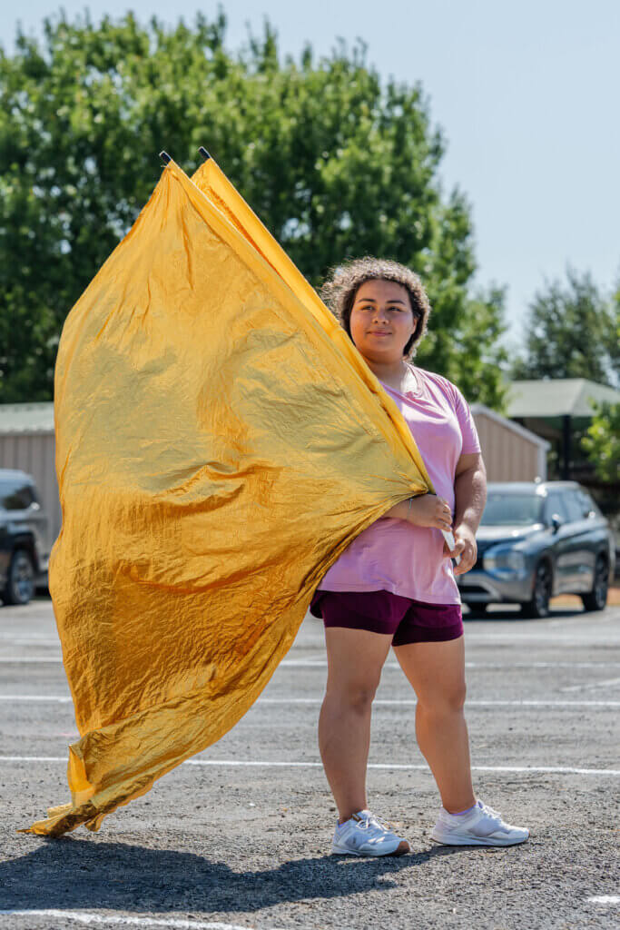 student holding flag