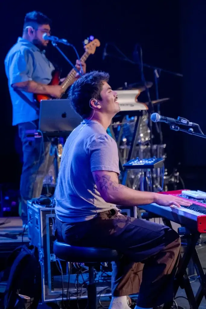 student playing instruments on stage